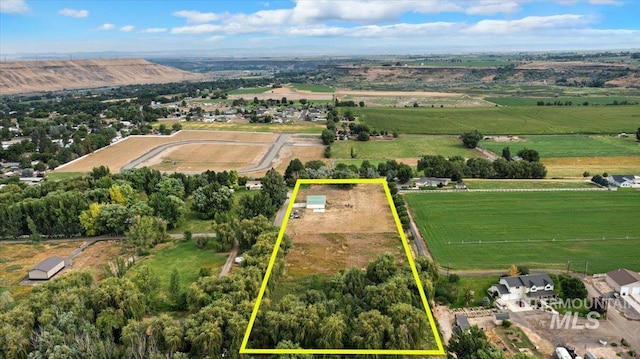 birds eye view of property with a rural view