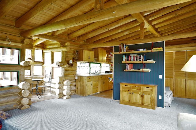 interior space featuring rustic walls, lofted ceiling with beams, and wooden ceiling