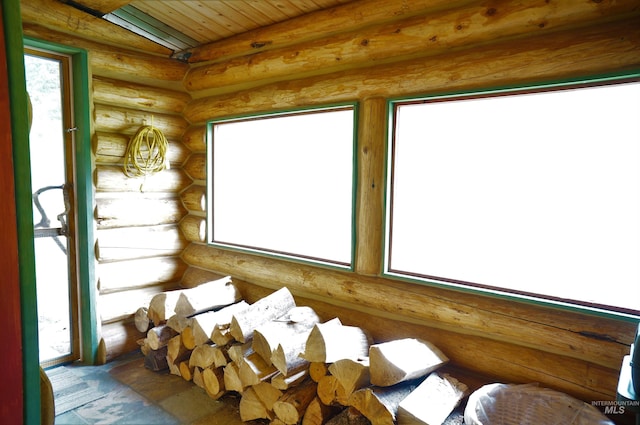 interior space featuring a wealth of natural light and rustic walls