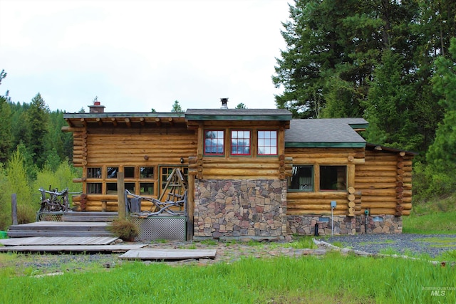 back of house featuring a wooden deck