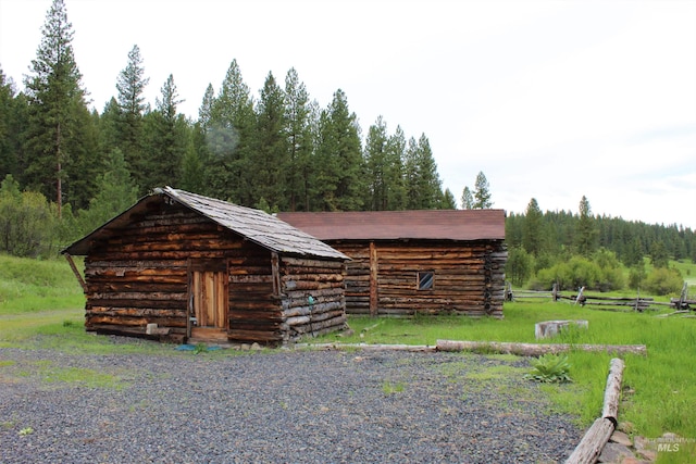 view of front of house featuring a storage shed