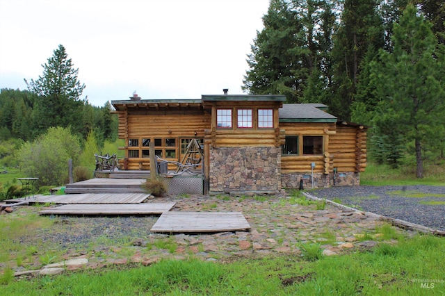 rear view of property with a deck