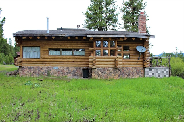 exterior space with a front lawn