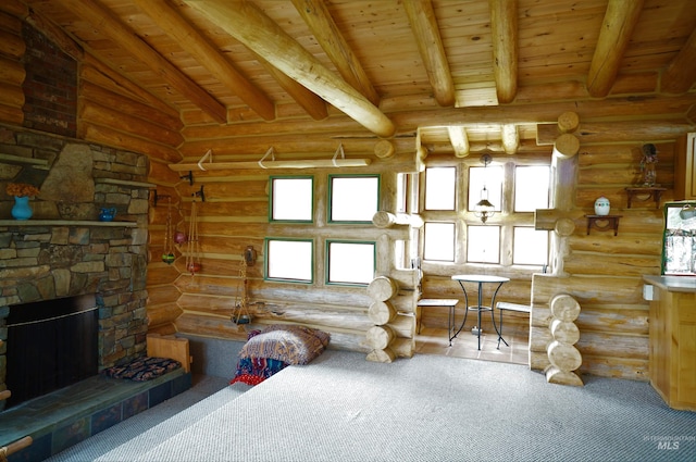 living room with beamed ceiling, wooden ceiling, a fireplace, and rustic walls