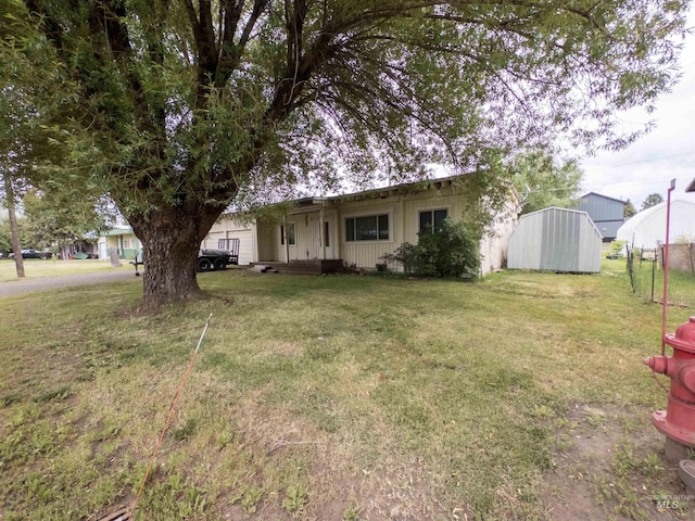 300 S Morgan Ave, New Meadows, ID 83654 - view of front facade featuring a front lawn and a storage shed
