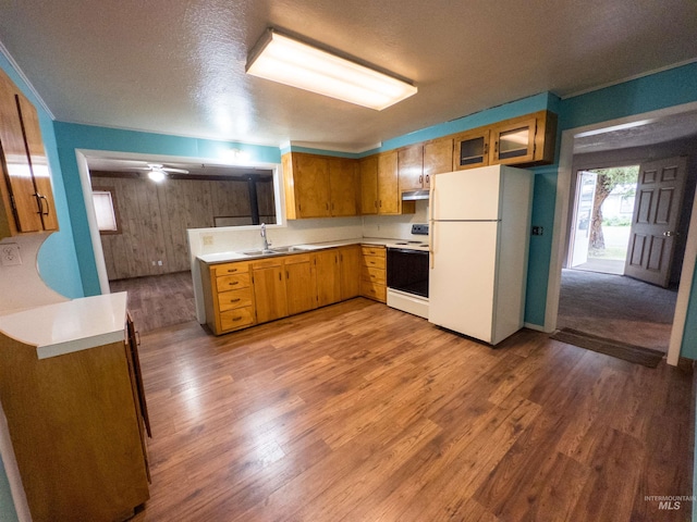 300 S Morgan Ave, New Meadows, ID 83654 - kitchen featuring white appliances, under cabinet range hood, light countertops, light wood-style floors, and brown cabinetry