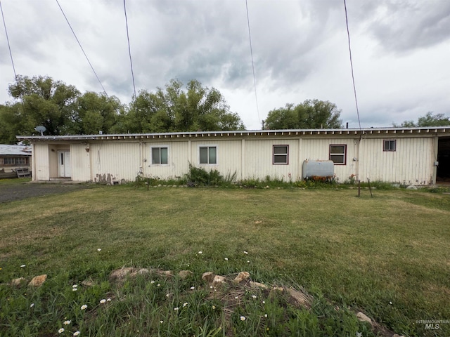 300 S Morgan Ave, New Meadows, ID 83654 - back of house featuring a yard and oil tank