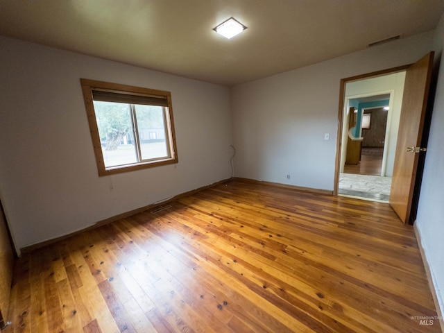 300 S Morgan Ave, New Meadows, ID 83654 - empty room with wood-type flooring and baseboards