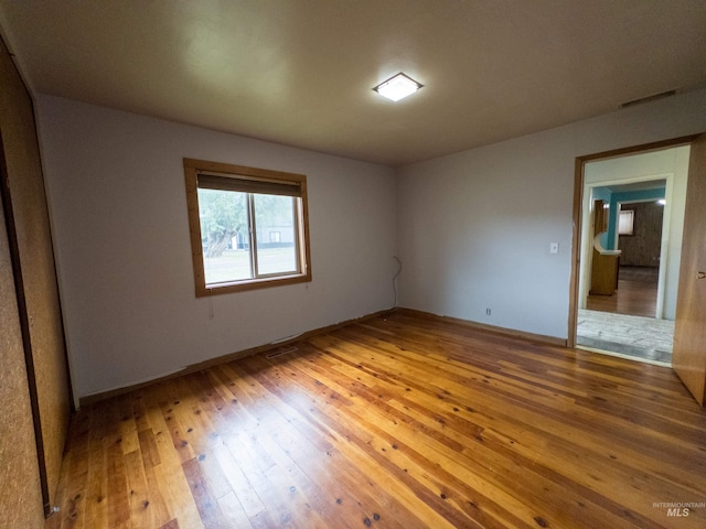 300 S Morgan Ave, New Meadows, ID 83654 - empty room with hardwood / wood-style flooring and baseboards