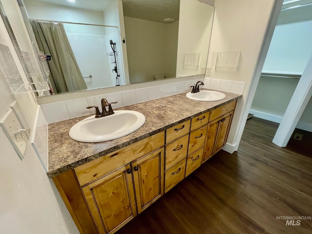 bathroom with vanity, hardwood / wood-style floors, toilet, and curtained shower