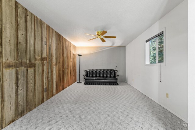 1718 Warren Wagon Rd, Mccall, ID 83638 - unfurnished room with ceiling fan, carpet, and wood walls