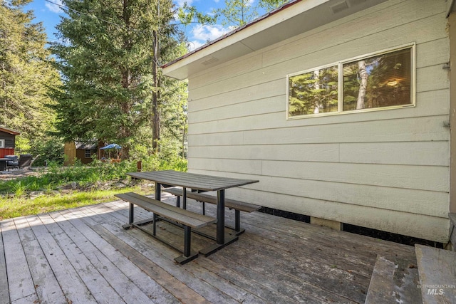 1718 Warren Wagon Rd, Mccall, ID 83638 - wooden terrace with outdoor dining area
