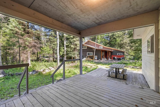 1718 Warren Wagon Rd, Mccall, ID 83638 - wooden deck with view of wooded area
