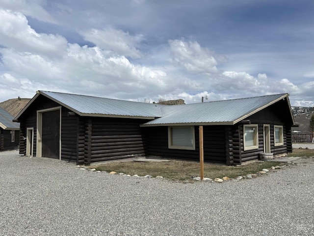 1150 Eva Falls Ave, Stanley, ID 83278 - view of side of property with log exterior and metal roof