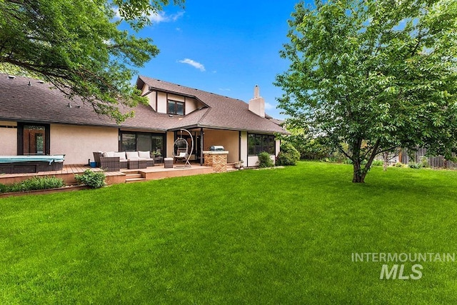 11151 W Hinsdale St, Boise, ID 83713 - back of house with an outdoor living space, a chimney, a lawn, stucco siding, and roof with shingles