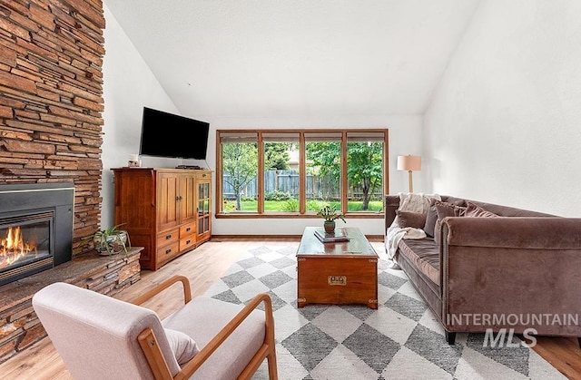 11151 W Hinsdale St, Boise, ID 83713 - living area featuring a fireplace, light wood-style flooring, and high vaulted ceiling