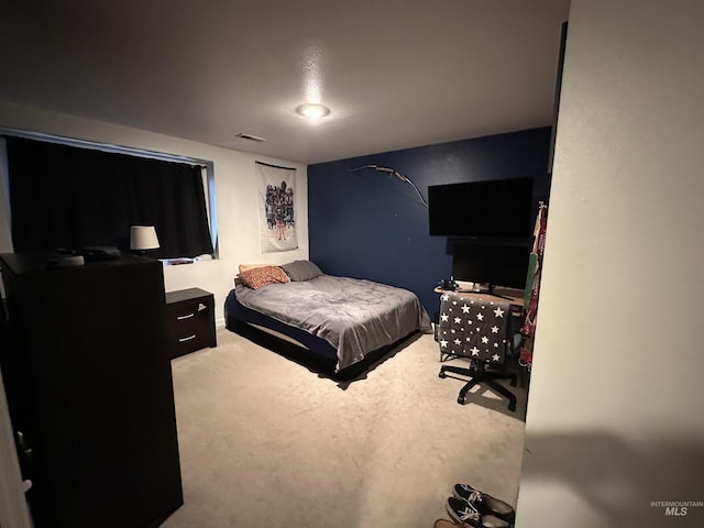 bedroom featuring carpet