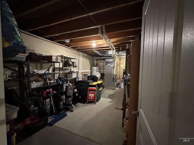 basement featuring gas water heater and heating unit