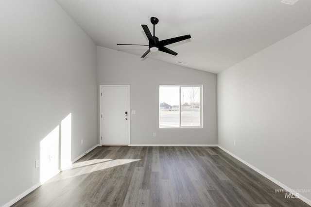 unfurnished living room with lofted ceiling, wood finished floors, visible vents, a ceiling fan, and baseboards