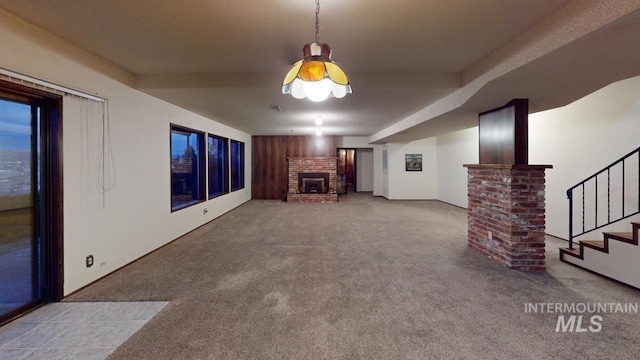 unfurnished living room featuring light carpet and a fireplace