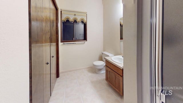 1545 7th Ave, Clarkston, WA 99403 - bathroom with tile patterned floors, vanity, and toilet