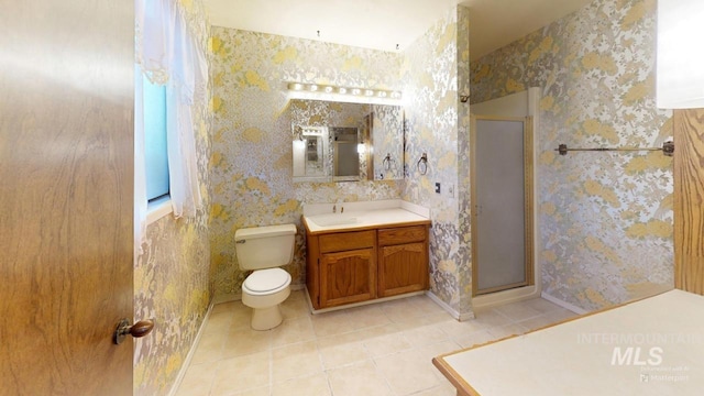 bathroom with vanity, toilet, an enclosed shower, and tile patterned flooring