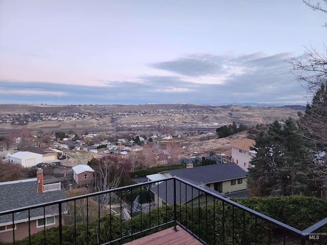 view of balcony at dusk