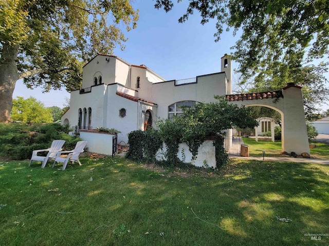 view of property exterior featuring a yard