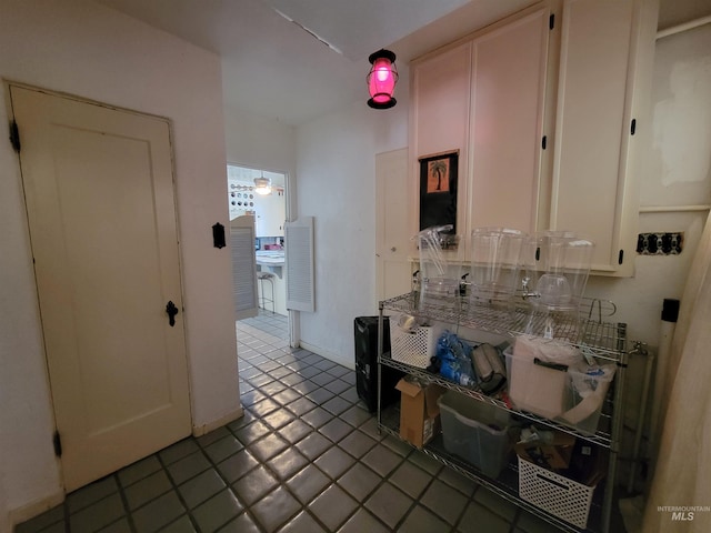 kitchen featuring white cabinets and tile patterned floors