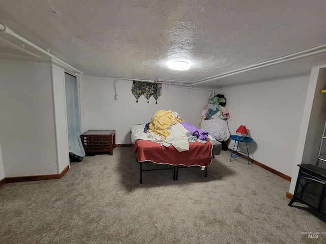 carpeted bedroom featuring a textured ceiling