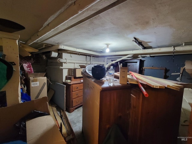 basement with a textured ceiling