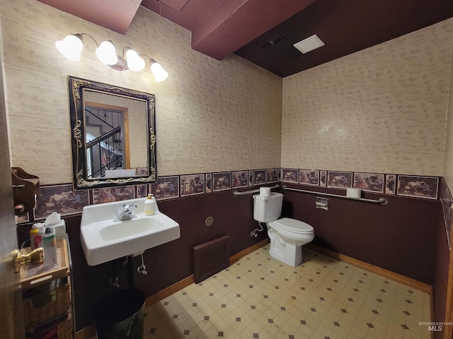 bathroom featuring sink and toilet