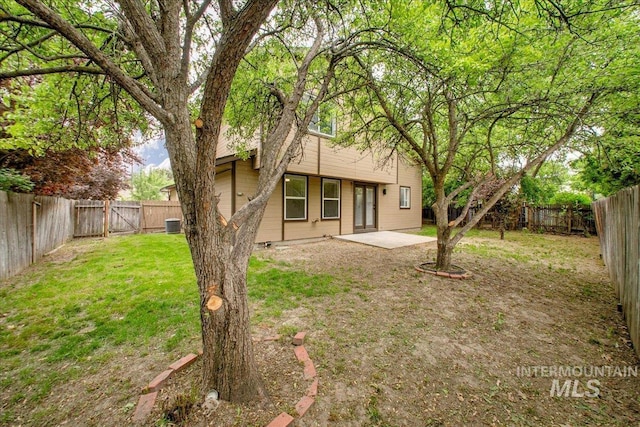 back of property featuring a patio and central AC