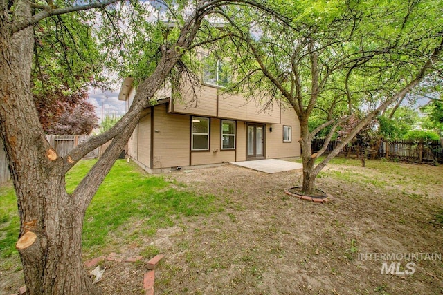 back of property with a patio area