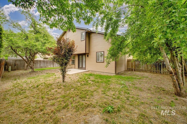 rear view of property with a patio area