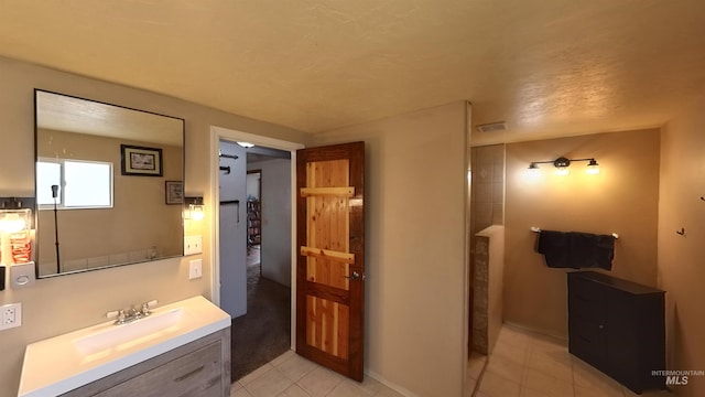 full bathroom featuring tile patterned flooring, visible vents, and vanity