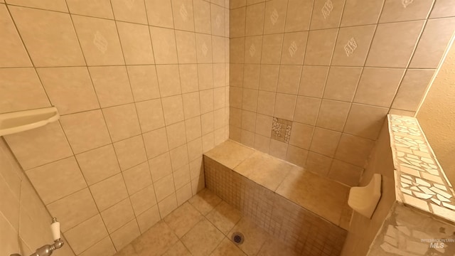 full bath featuring a tile shower