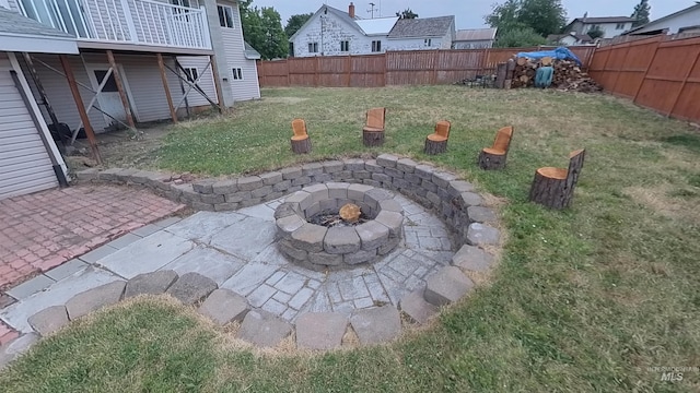 view of yard featuring an outdoor fire pit, a patio area, and a fenced backyard