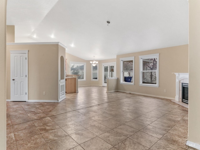 unfurnished living room with a chandelier and lofted ceiling