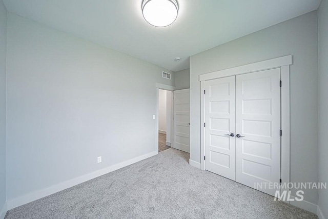 665 Emma Ct, Idaho Falls, ID 83404 - unfurnished bedroom with carpet, baseboards, and a closet