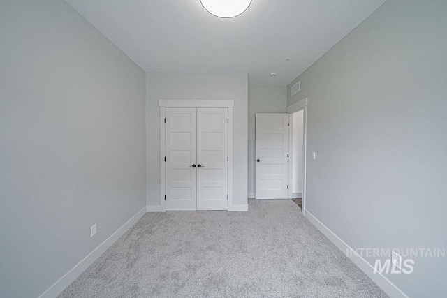 665 Emma Ct, Idaho Falls, ID 83404 - unfurnished bedroom with carpet flooring, baseboards, and a closet