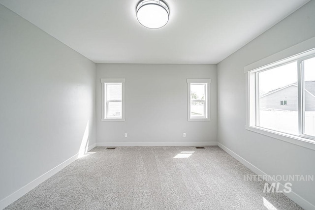 665 Emma Ct, Idaho Falls, ID 83404 - spare room featuring light colored carpet and baseboards