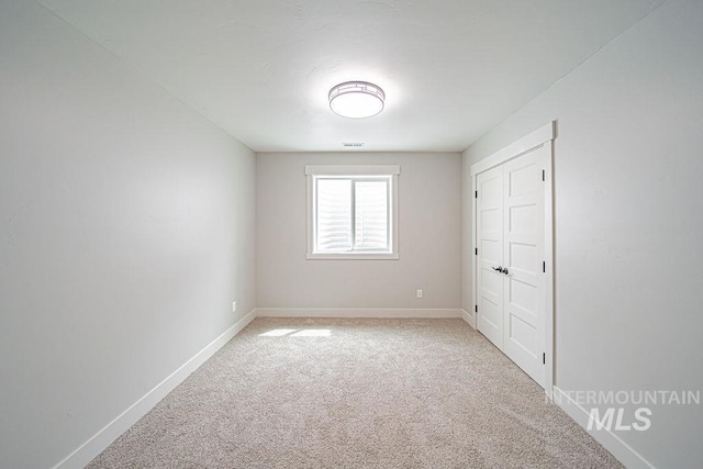 665 Emma Ct, Idaho Falls, ID 83404 - empty room featuring light colored carpet and baseboards
