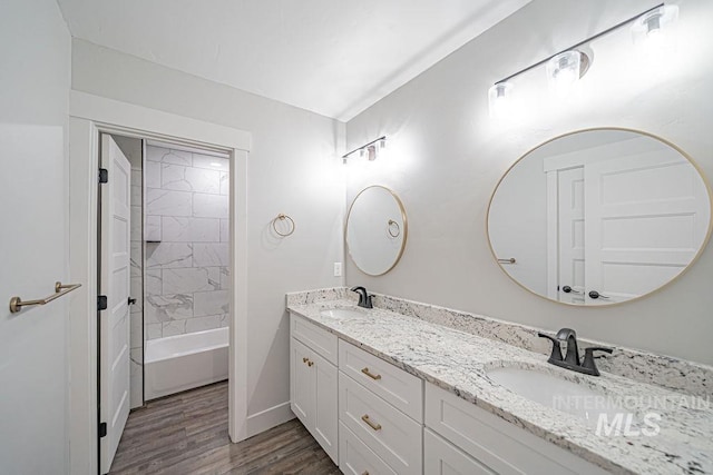 665 Emma Ct, Idaho Falls, ID 83404 - full bathroom with wood finished floors, double vanity, and baseboards
