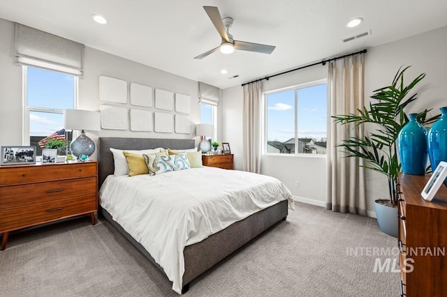 bedroom with carpet flooring, visible vents, and recessed lighting