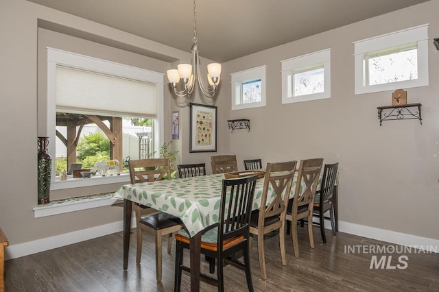 4519 Middlesboro Way, Caldwell, ID 83607 - dining area with baseboards, plenty of natural light, wood finished floors, and a chandelier