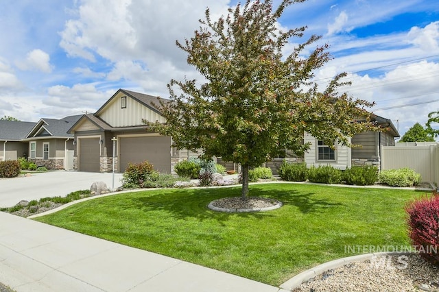 4519 Middlesboro Way, Caldwell, ID 83607 - view of front of home with an attached garage, board and batten siding, stone siding, and concrete driveway