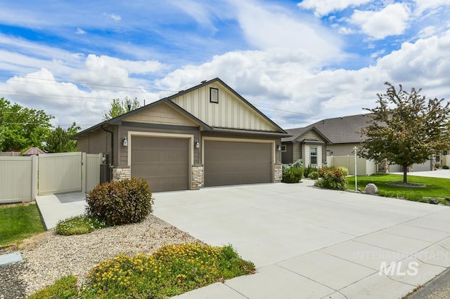 4519 Middlesboro Way, Caldwell, ID 83607 - view of front facade with board and batten siding, an attached garage, fence, and concrete driveway