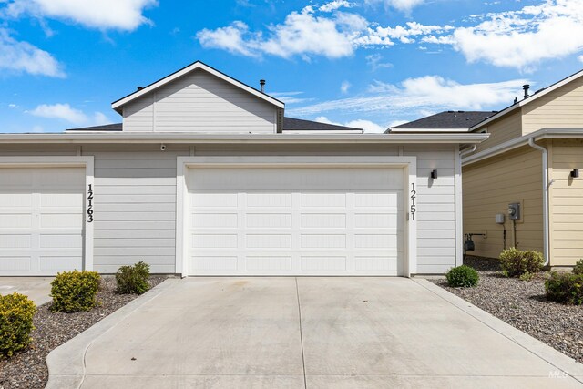 garage with concrete driveway