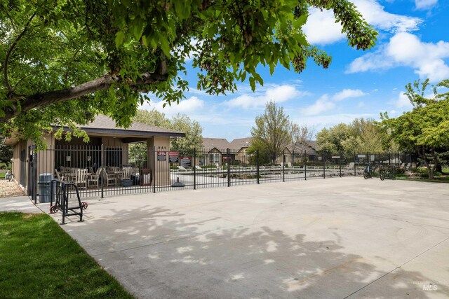 view of property's community featuring fence